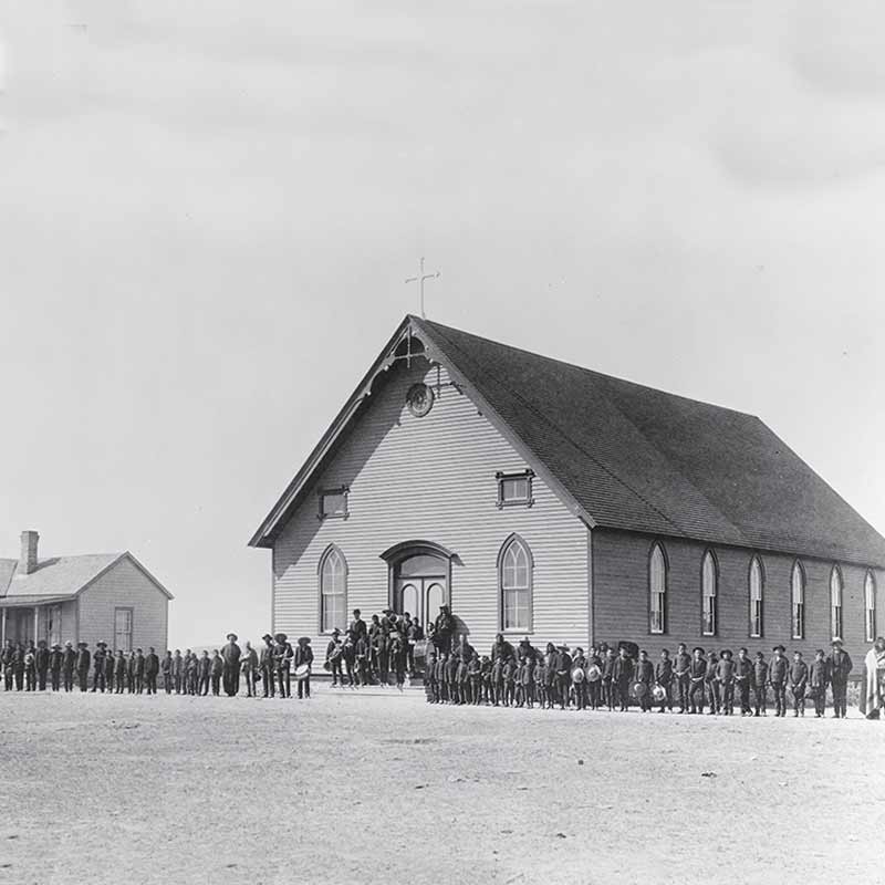 An undated photo likely from the late 19th century of St. Francis Xavier Mission Church and Rectory